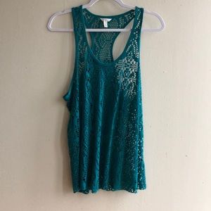 Teal tank top with cut outs.